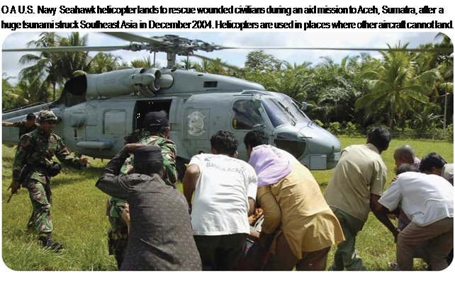 Подпись: О A U.S. Navy Seahawk helicopter lands to rescue wounded civilians during an aid mission to Aceh, Sumatra, after a huge tsunami struck Southeast Asia in December 2004. Helicopters are used in places where other aircraft cannot land. 