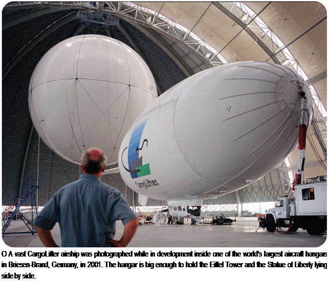 Подпись: О A vast CargoLifter airship was photographed while in development inside one of the world's largest aircraft hangars in Briesen-Brand, Germany, in 2001. The hangar is big enough to hold the Eiffel Tower and the Statue of Liberty lying side by side. 