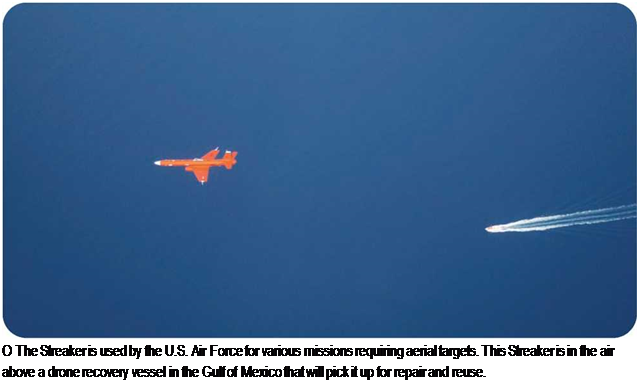 Подпись: О The Streaker is used by the U.S. Air Force for various missions requiring aerial targets. This Streaker is in the air above a drone recovery vessel in the Gulf of Mexico that will pick it up for repair and reuse. 