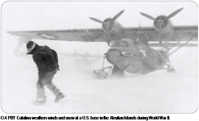 Подпись: О A PBY Catalina weathers winds and snow at a U.S. base in the Aleutian Islands during World War II. 