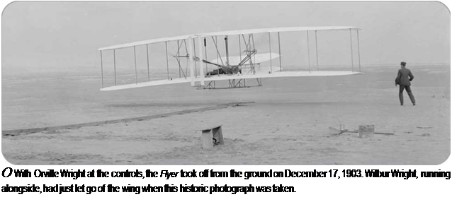 Подпись: О With Orville Wright at the controls, the Flyer took off from the ground on December 17, 1903. Wilbur Wright, running alongside, had just let go of the wing when this historic photograph was taken. 