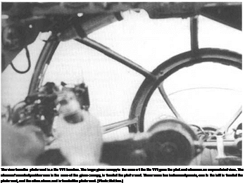 Подпись: The view from the pilot's seat in a He 111 bomber. The large glass canopy in the nose of the He 111 gave the pilot and observer an unparalleled view. The observer's combat position was in the nose of the glass canopy, in front of the pilot's seat. There were two instrument panels, one to the left in front of the pilot's seat, and the other above and in front of the pilot's seat. (Photo: Batcher.) 