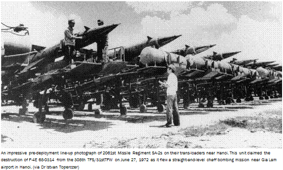 Подпись: An impressive pre-deployment line-up photograph of 2061st Missile Regiment SA-2s on their trans-loaders near Hanoi. This unit claimed the destruction of F-4E 68-0314 from the 308th TFS/31stTFW on June 27, 1972 as it flew a straight-and-level chaff bombing mission near Gia Lam airport in Hanoi. (via Dr Istvan Toperczer) 
