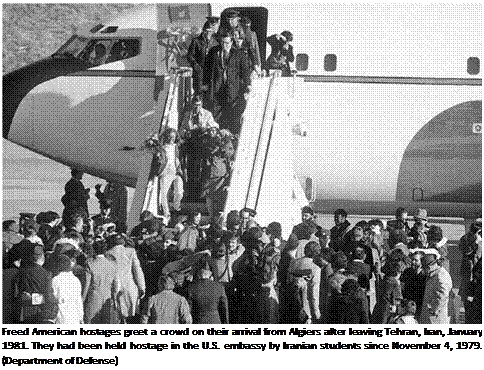Подпись: Freed American hostages greet a crowd on their arrival from Algiers after leaving Tehran, Iran, January 1981. They had been held hostage in the U.S. embassy by Iranian students since November 4, 1979. (Department of Defense) 